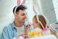 Dad with you fun preparing for Easter.Dad and his little daughter together have fun while preparing for Easter holidays Royalty Free Stock Photo