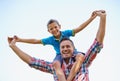 Dad, young boy and shoulders of parent, sky and outdoors in park with smile. Laugh, love and bonding with son and father Royalty Free Stock Photo