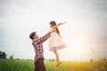 Daddy carrying his daughter with nature and sunlight, enjoyment Royalty Free Stock Photo