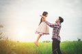 Daddy carrying his daughter with nature and sunlight, enjoyment Royalty Free Stock Photo