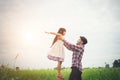 Daddy carrying his daughter with nature and sunlight, enjoyment Royalty Free Stock Photo