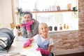 Daddy and daughter enjoying traditional weekend housecleaning