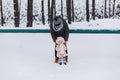 Daddy and daughter walking with snow-covered pine forest Royalty Free Stock Photo
