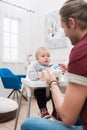 daddy feeding his little son with baby food Royalty Free Stock Photo