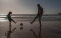 Daddy with kid boy on a summer day. Daddy with kid boy playing on a summer day. Father and son play soccer or football Royalty Free Stock Photo