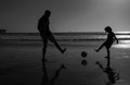 Daddy with kid boy on a summer day. Daddy with kid boy playing on a summer day. Father and son play soccer or football Royalty Free Stock Photo