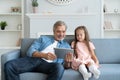 Daddy with little girl playing with tablet. Royalty Free Stock Photo