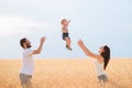 Daddy, mom and child having fun outdoors