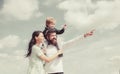 Daddy, mommy and child son. Happy family - child son playing with paper airplane. Portrait of happy father giving son Royalty Free Stock Photo