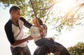 Daddys got you. a happy father pushing his daughter on a tyre swing. Royalty Free Stock Photo