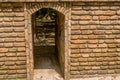 Tunnel through brick structure in recreational forest park