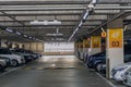 Man next to car in full parking garage