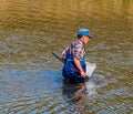 Man wearing blue waders in Kumgang river