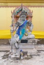 Daemon king statue sitting with spear in the hand Royalty Free Stock Photo