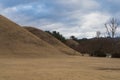 Daereungwon Tomb Complex and Cheonmachong Hwangnam Daechong during winter evening at Gyeongju , South Korea : 10 February 2023 Royalty Free Stock Photo