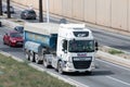 DAF CF truck loading a blue container trailer along Barcelona's Ronda Litoral