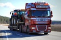 DAF XF Hauls Farm Tractors along Road at Spring