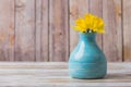 Daffodils in a vintage blue pottery vase