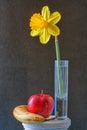 Dafodil arrangement with apple