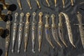 Daggers and knives in steel case in the daytime on the market