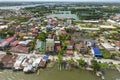 Dagupan, Pangasinan, Philippines - Boats lined along the river near a residential area. Aerial view of the city