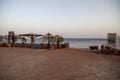 Red Sea coast, view of restaurant over sandy beach, Dahab, Egypt