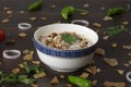 Dahi vada or bhalla is a type of chaat. Dahi bhalla bowl on textured background
