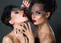 Dainty. Two Provocative Women in Veils with Cherry Berries. Temptation