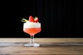 daiquiri in coupe glass, strawberry on rim
