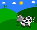 A dairy cow eating grass in a meadow with beautiful sunshine
