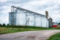 Dairy factory. Large cisterns of metallic color outdoors.