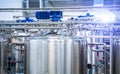 Dairy factory with milk pasteurization tank and pipes Royalty Free Stock Photo