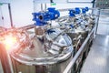 Dairy factory with milk pasteurization tank and pipes Royalty Free Stock Photo