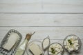 Dairy fresh produce on a wooden white background in a rustic style.