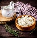 Dairy product, milk and cottage cheese on dark wooden table.