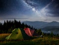 Dairy Star Trek above the tents. Dramatic and picturesque scene at night mountains. Carpathian Ukraine Europe Royalty Free Stock Photo