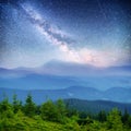 Dairy Star Trek in the woods. Dramatic and picturesque scene. Fantastic starry sky and the milky way Royalty Free Stock Photo