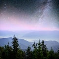 Dairy Star Trek in the woods. Dramatic and picturesque scene. Fantastic starry sky and the milky way