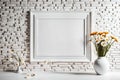 Daisies in a stylized vase in a white landscape frame mockup next to a painted brick wall. Mockup of an empty frame.