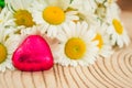 Daisy flower bouquet and red heart chocolates