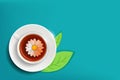 Daisy flower in a cup of tea. Herbal chamomile drink Royalty Free Stock Photo