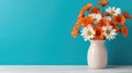 Daisy flowers bouquet in orange vase on white wooden coffee table near turquoise wall background. Interior design of modern room Royalty Free Stock Photo