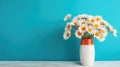 Daisy flowers bouquet in orange vase on white wooden coffee table near turquoise wall background. Interior design of modern room Royalty Free Stock Photo