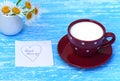 Daisy flowers and cup of milk with good morning note Royalty Free Stock Photo