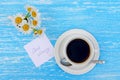 Daisy flowers and cup of tea with good morning note Royalty Free Stock Photo
