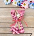 Daisy Flowers in Red White and Blue Colors as a Party Invitation Card Laying on Rustic Board Table with room or space for your wor