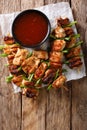 Dakkochi, Korean Chicken on a Stick close-up. Vertical top view