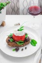 Dakos barley rusk with mizitra cheese, tomato, olives, oregano and olive oil. Cretan appetizer Royalty Free Stock Photo