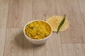 Dal khichadi or Khichdi Tasty Indian recipe served in bowl over moody background is made of toovar dal and rice combined with Royalty Free Stock Photo