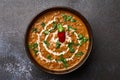 Dal Makhani at dark background. Dal Makhani - traditional indian cuisine puree dish with urad beans, red beans, butter, spices and